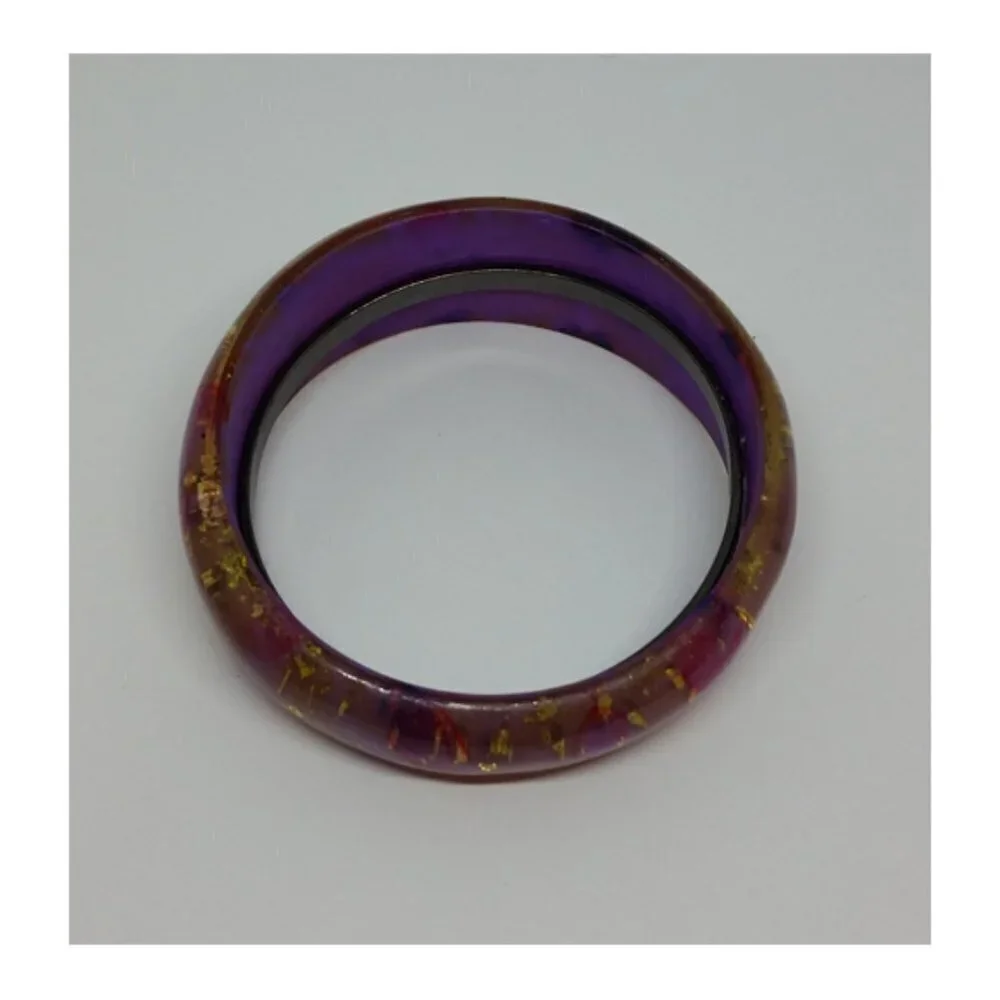 Lucite style purple bangle bracelet with glitter flakes and butterflies